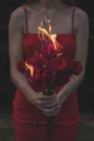 A woman in a red - Credits: pexels