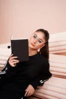 A young woman in sportswear - Credits: pexels