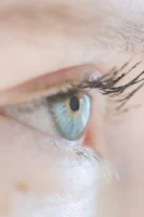 Closeup of opened blue eye - Credits: pexels