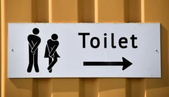 A funny toilet sign with - Credits: pexels