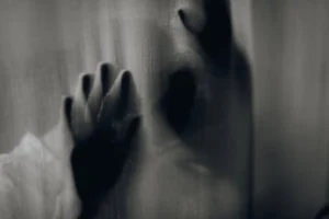 Blurred hands pressed against a - Credits: pexels