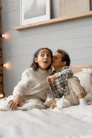 Two kids sharing secrets on - Credits: pexels