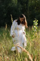 A woman in a white - Credits: pexels