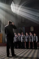 A boys choir rehearsing in - Credits: pexels