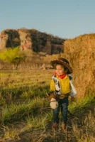Adorable child in cowboy costume - Credits: pexels