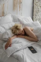 Lazy female resting in bed - Credits: pexels