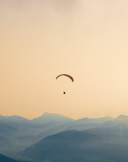 A paraglider soars gracefully over - Credits: pexels