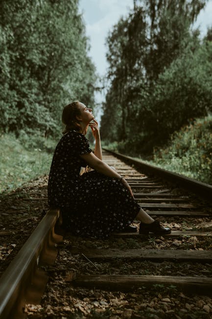 Woman in a dress sitting - Credits: pexels