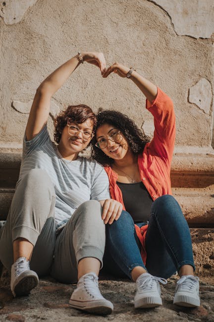 Two women sitting and forming - Credits: pexels