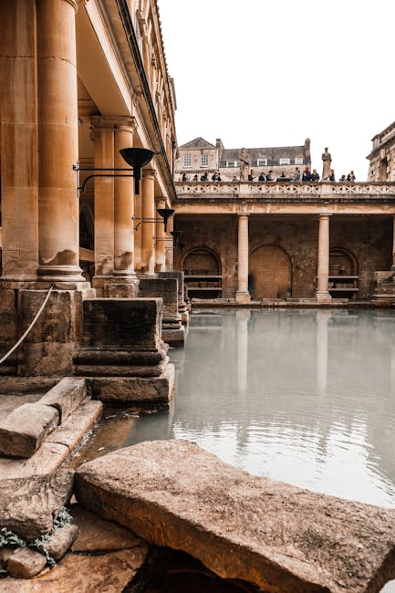 Ancient Roman bath with columns and water reflecting historical architecture. - Credits: pexels.com