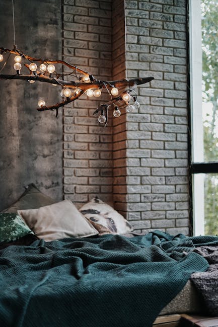 A tranquil bedroom with rustic lighting and a brick wall, offering a cozy and serene atmosphere. - Credits: pexels
