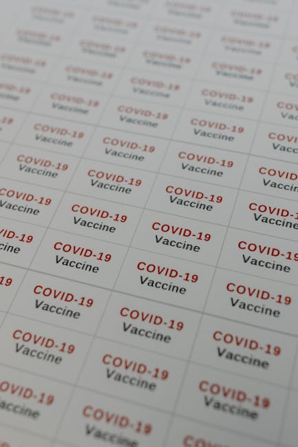 Close-up of COVID-19 vaccine labels arranged in rows, ideal for healthcare stock images. - Credits: pexels