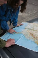 A couple examines a map - Credits: pexels