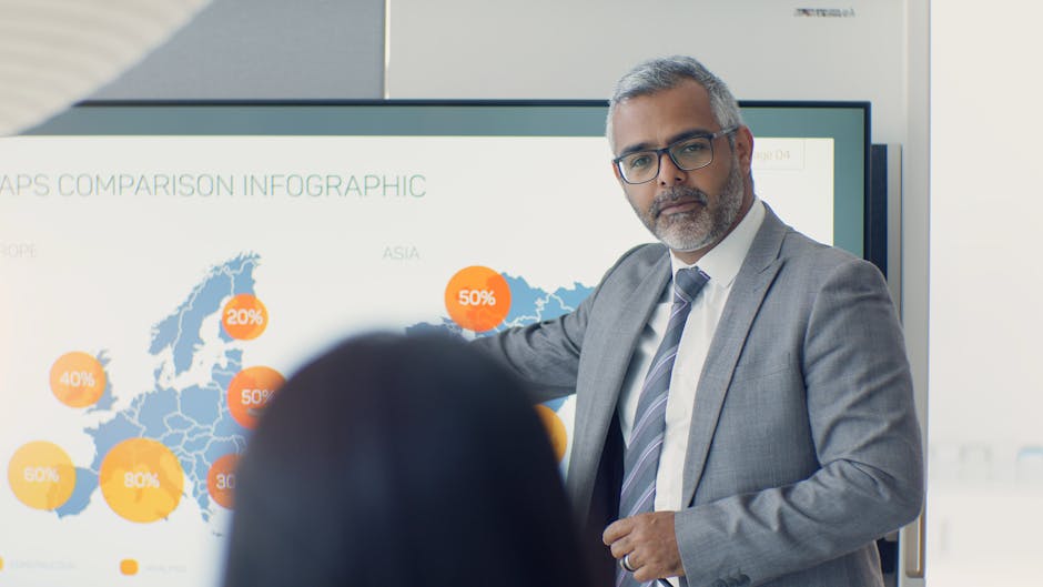 Professional man presenting data with - Credits: pexels