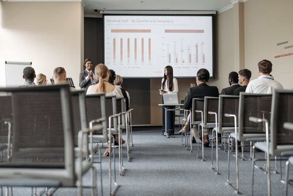 Business conference attendees listen to - Credits: pexels